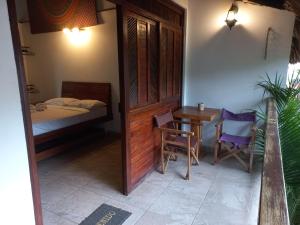 En eller flere senge i et værelse på El Leon Feliz Palomino