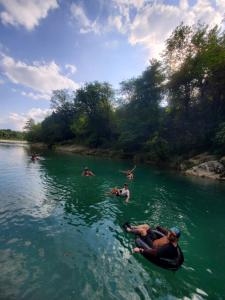 a group of people swimming in a river at Cha Cha Backpackers in Martvili