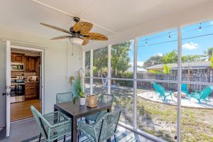 a kitchen and dining room with a table and chairs at Tropical getaway with coastal charm in Pompano Beach