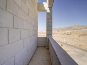 a room with a view of the desert from a building at ENG-Murjan Apartment in Aqaba