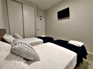 Кровать или кровати в номере Funchal Apartments - New Botanic Garden Petit Studios