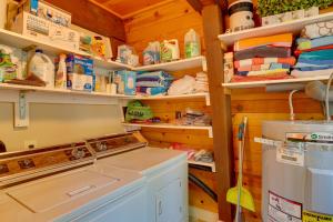a laundry room with a washing machine in it at Westwood Lakefront Cabin with Hot Tub and Boat Dock! in Westwood +25 photos