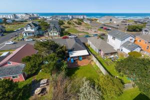 an aerial view of a town with houses and the ocean at Nyevana Beach House in Newport