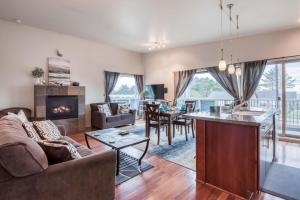 a living room with a couch and a table at Sea Depoe Bay in Depoe Bay