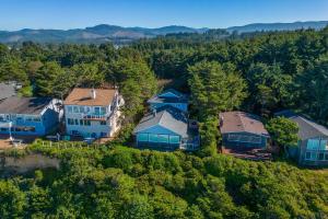 an aerial view of a house in the woods at Lawton's View in Lincoln City