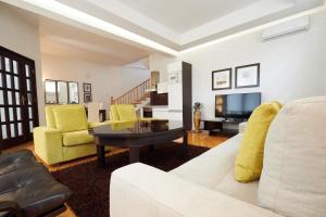 a living room with a couch and a table at Villa Selma in Sarajevo