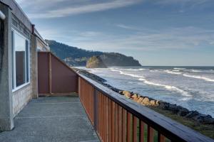 a balcony of a house with a view of the ocean at Pacific Sands Resort # 21 in Neskowin