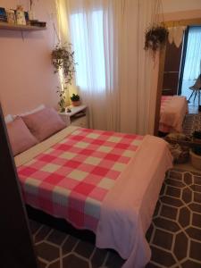 Een bed of bedden in een kamer bij casa flores