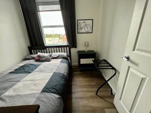 Кровать или кровати в номере Sutton - Condo Au Coeur du Village