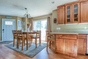 a kitchen and dining room with a table and chairs at Browne's Beach N'Pad in Lincoln City