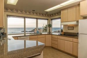 a kitchen with a view of the ocean at Pirate's Cove in Depoe Bay