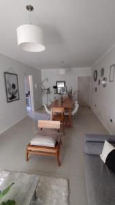 a living room with a table and a dining room at Consorcio María Auxiliadora I Dpto Vino y Chocolate in San Juan