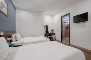 TV a/nebo společenská místnost v ubytování Gold Time Hotel Da Nang