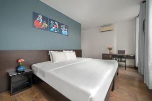 Postel nebo postele na pokoji v ubytování Gold Time Hotel Da Nang