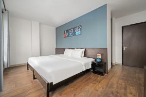 Postel nebo postele na pokoji v ubytování Gold Time Hotel Da Nang
