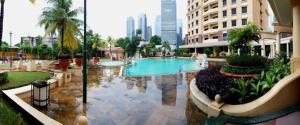 a large pool in the middle of a building at Apartemen Kusuma Chandra in Jakarta