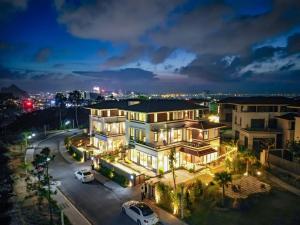 a large house with lights on at night at Villa FLC Hạ Long bt3-6 in Ha Long