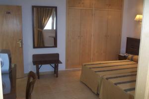 Postel nebo postele na pokoji v ubytování Hotel Tio Felipe