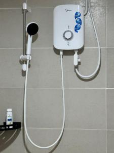 a shower in a bathroom with a shower at SUMMER SUITES APARTMENT-The Summer Shopping Mall in Kota Samarahan