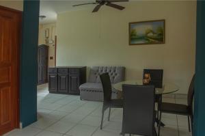 a living room with a table and a couch at Organic Garden in San José