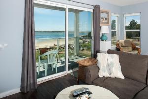 a living room with a view of the ocean at Waters Edge 214 in Lincoln City