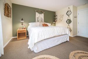 a bedroom with a bed with a white bedspread at Waters Edge 304 in Lincoln City