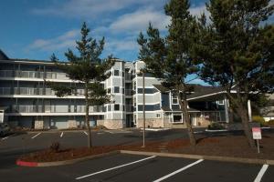 a parking lot in front of a large building at Waters Edge 308 in Lincoln City