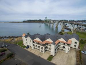 an aerial view of a building next to a bridge at Windward at the Regatta in Newport