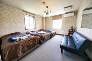 Postel nebo postele na pokoji v ubytování Hotel Camelot