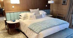 Voodi või voodid majutusasutuse The Carlin Boutique Hotel toas