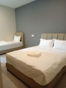Krevet ili kreveti u jedinici u objektu GRAND SRI MUADZAM HOTEL