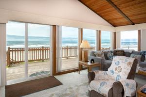 a living room with a view of the ocean at Twin Coho in Rockaway Beach