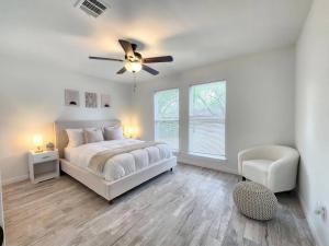 a bedroom with a bed and a ceiling fan at NEW! H-Town Getaway Near Medical Center! in Houston