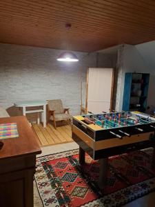 a living room with a table and a chessboard at House Franja - Spa and relax in Kranjska Gora