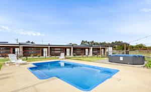 a swimming pool in the backyard of a house at Lakeview Hideaway in Drysdale