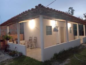a view of a house with a pergola at Hospedaria genivaldo in Santo Amaro