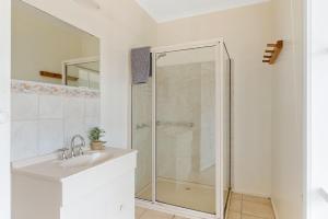 a bathroom with a shower and a sink at Key Lime Retreat in Cape Woolamai +12 photos