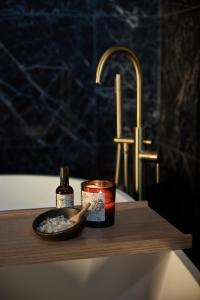 a bathroom counter with a candle and a bowl of food at The Interlude in Melbourne