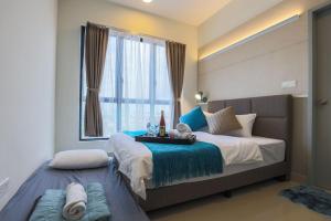 a bedroom with a large bed with a window at 7mins to Mid Valley Central Of Old Klang Road By Nexx Field in Kuala Lumpur +108 photos