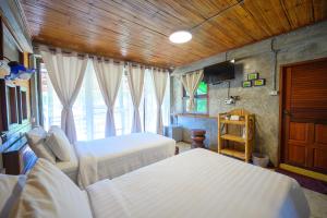 Postel nebo postele na pokoji v ubytování Herntai Resort Maelanoi + 37 fotografií