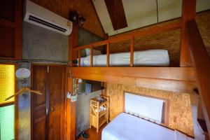 Postel nebo postele na pokoji v ubytování Herntai Resort Maelanoi