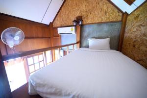 Postel nebo postele na pokoji v ubytování Herntai Resort Maelanoi