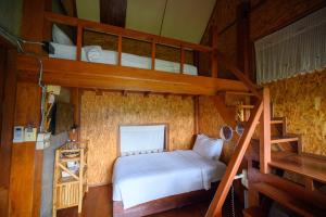 Postel nebo postele na pokoji v ubytování Herntai Resort Maelanoi