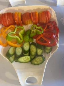 a plastic container filled with vegetables and carrots and peppers at Al Namteh Lodge in ‘Ābil