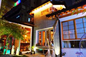 a house with lights on the side of it at NagNe House Boutique Hanok in Seoul