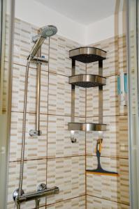 a shower with two shelves in a bathroom at Don Mimí l'affittacamere in Messina