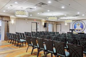 a conference room with black chairs and a sign at Holiday Inn Hotel & Suites Slidell by IHG in Slidell +55 photos