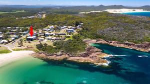 an aerial view of an island with a red marker at On the Beach Getaway in One Mile