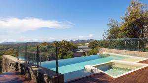 a swimming pool on the roof of a house at One Mile Retreat in Anna Bay