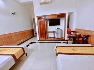 Giường trong phòng chung tại Trúc Hoàng Hà Hotel +44 ảnh